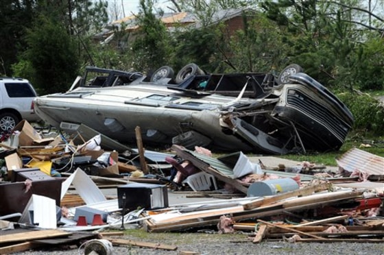 A recreational vehicle is overturned and flattened in Rainsville, Ala., Thursday, April, 28, 2011. A least 32 people died when a tornado struck Dekalb County Wednesday. (AP Photo/ Birmingham News, Mark Almond) ** MAGS OUT NO SALES **